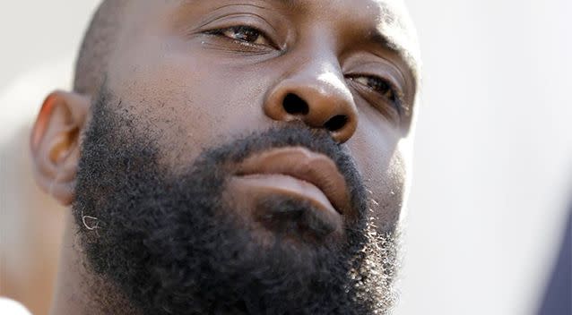 Michael Brown Sr listens to speakers during a news conference outside the Old Courthouse in St. Louis. His son Michael, 18, who was unarmed, was shot to death by a Ferguson police officer while walking with a friend down the centre of the street. Photo: AP.