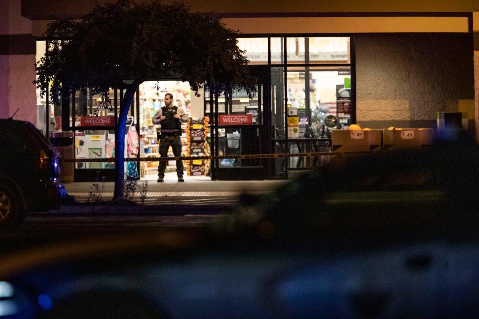 Emergency personnel respond to a shooting at the Forum shopping center in east Bend, Ore., Sunday, Aug. 28, 2022.