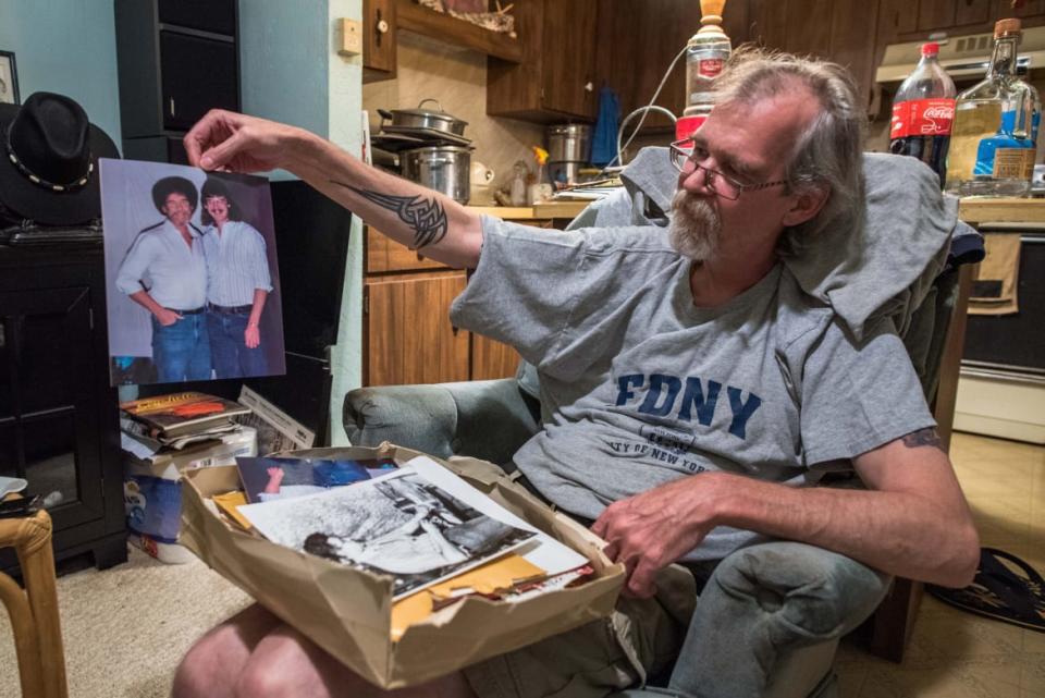 <div class="inline-image__caption"><p>Steve Ross admiring a picture of his father</p></div> <div class="inline-image__credit">Courtesy Alston Ramsay</div>