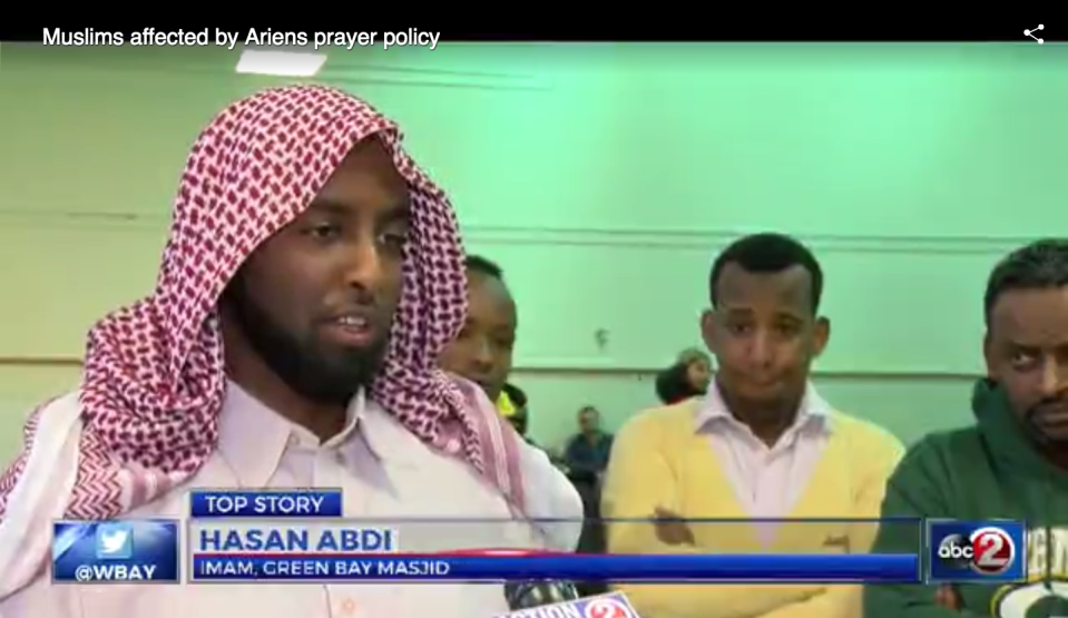 An Imam speaks to a local news agency about the dispute over prayer at Ariens. Screenshot/WBAY.com