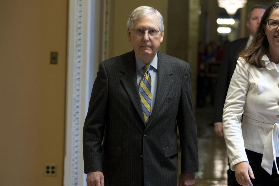 Senate Majority Leader Mitch McConnell, R-Ky., walks from his office to the Senate chamber, on Capitol Hill in Washington, Tuesday, Jan. 14, 2020. (AP Photo/Jose Luis Magana)