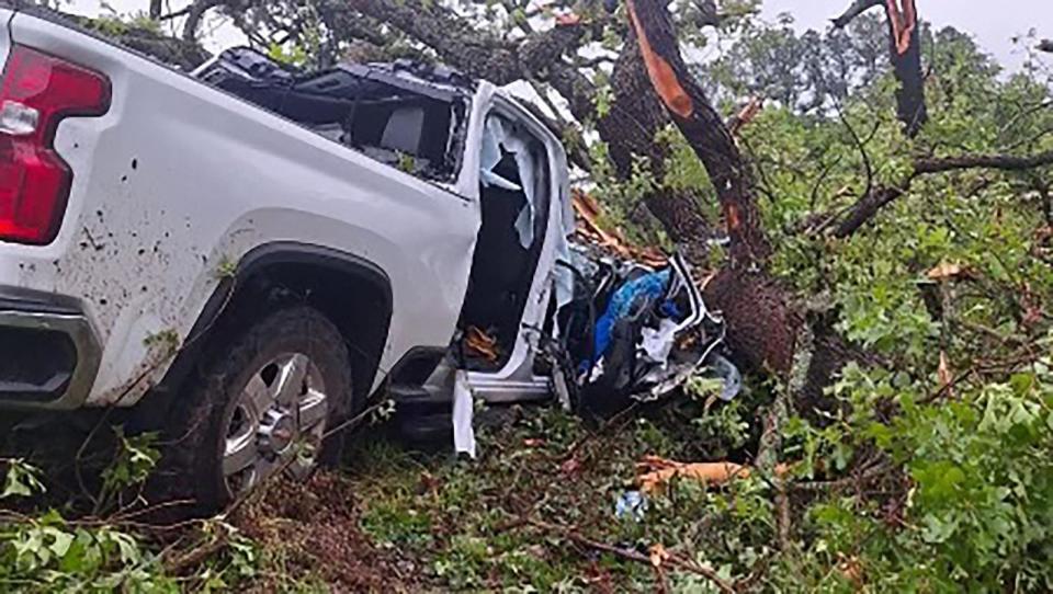 PHOTO: The tornado picked up the truck and tossed it into a pile of trees. (Courtesy of Johnny Baker)