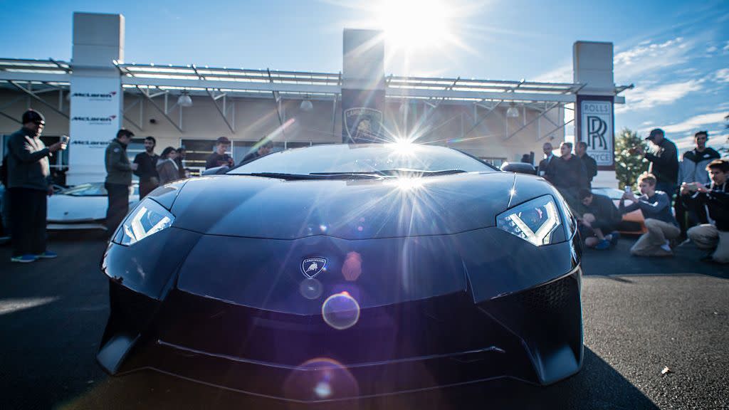 exotic car enthusiasts gather at sterling rolls royce to show off their lamborghinis, ferraris, and more