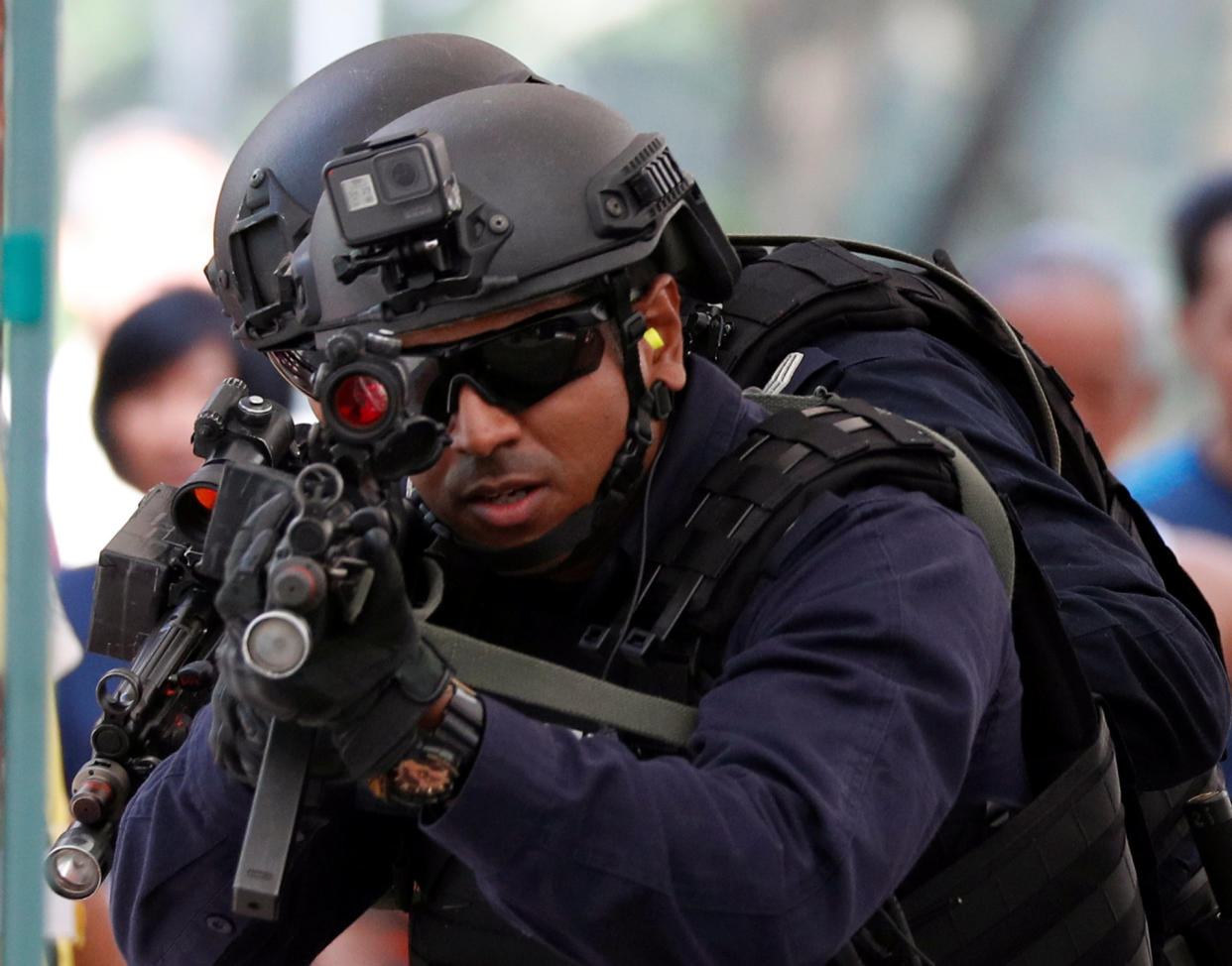 Police take part in a simulated gunmen attack demonstration for the public at a housing estate on 10 December 2017. (PHOTO: Reuters)