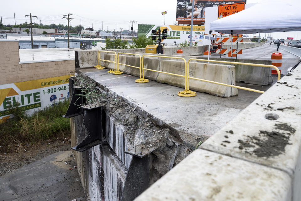 A section of the southbound side of Interstate 95 is seen removed as a news conference is held by the repaired section to announce the highway's reopening Friday, June 23, 2023 in Philadelphia. Workers put the finishing touches on an interim six-lane roadway that will serve motorists during construction of a permanent bridge.(AP Photo/Joe Lamberti)