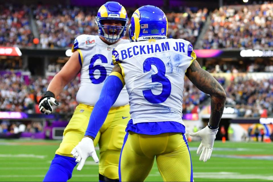 Los Angeles Rams’ Odell Beckham Jr. (R) celebrates with a teammate after scoring a touchdown during Super Bowl LVI between the Los Angeles Rams and the Cincinnati Bengals (AFP via Getty Images)