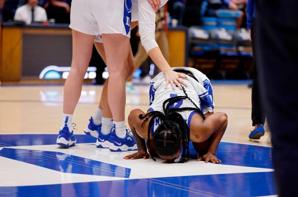 Duke’s Elizabeth Balogun kneels at center court following the Blue Devils’ 61-53 loss to Colorado in an NCAA Tournament second round game at Cameron Indoor Stadium on Monday, March 20, 2023, in Durham, N.C.