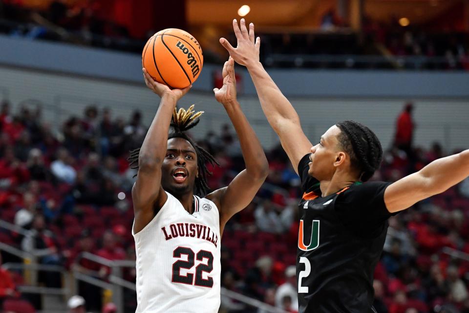 Louisville forward Kamari Lands (22) shoots over Miami guard Isaiah Wong (2) in a game at Louisville.