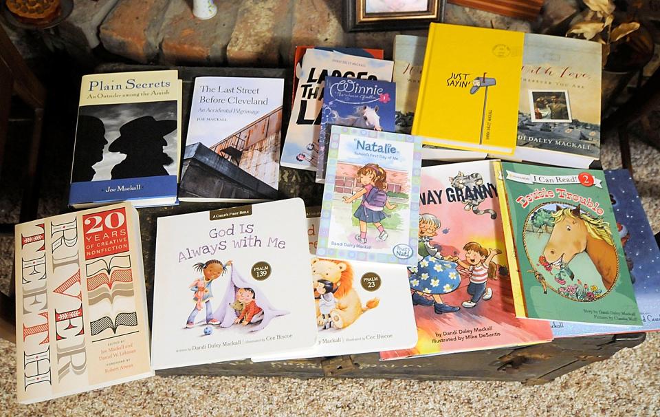 An assortment of Joe and Dandi Daley Mackall’s books at their home in Cinnamon Lake in Ashland County.