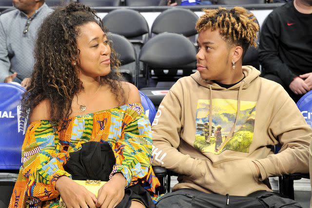 <p>Allen Berezovsky/Getty</p> Naomi Osaka and YBN Cordae attend a basketball game between the Los Angeles Clippers and the Washington Wizards at Staples Center in December 2019