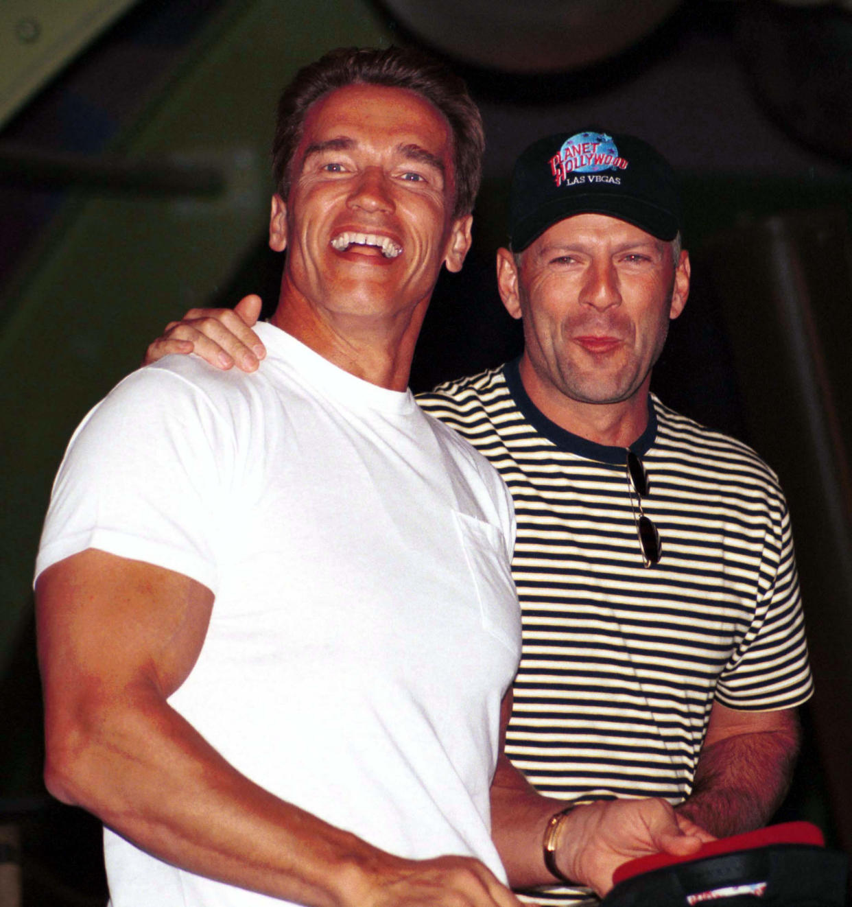Arnold Schwarzenegger and Bruce Willis at the opening of Planet Hollywood July 25, 1994 in Las Vegas, Nevada. (Scott Harrison / Getty Images)