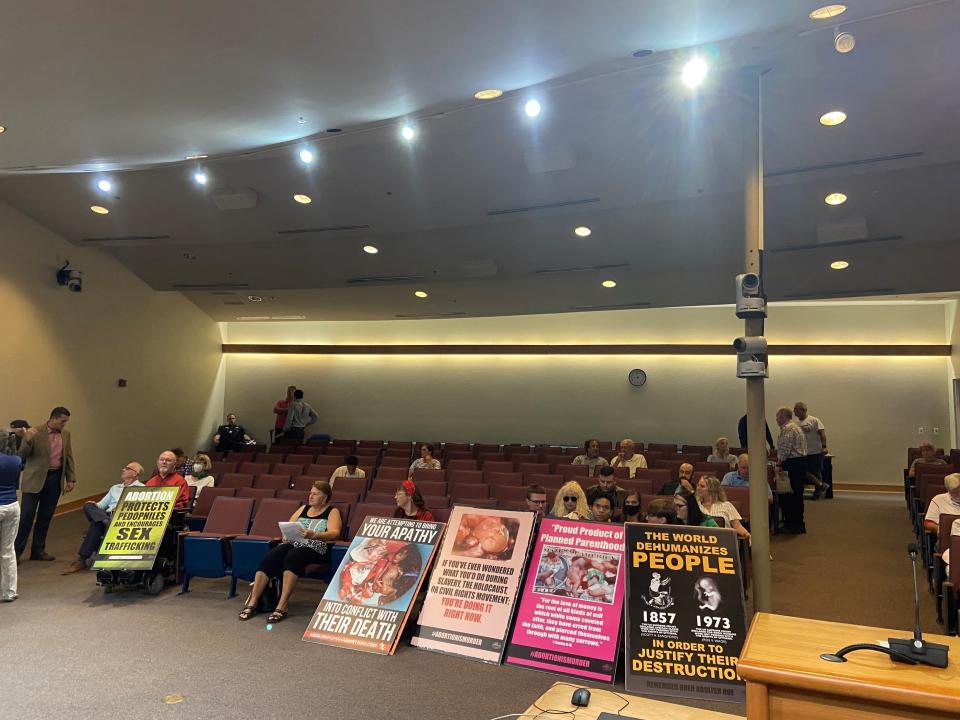 Santa Rosa County residents on Tuesday listen as the Santa Rosa County Commission discusses a "trigger ban" ordinance that would prohibit abortion clinics from operating in the county.