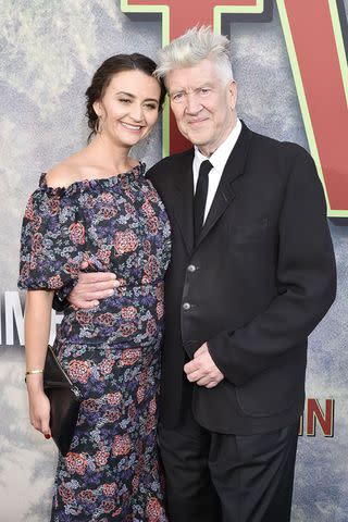 <p>David Crotty/Patrick McMullan via Getty</p> Emily Stofle and David Lynch attend the World Premiere Of Showtime's 