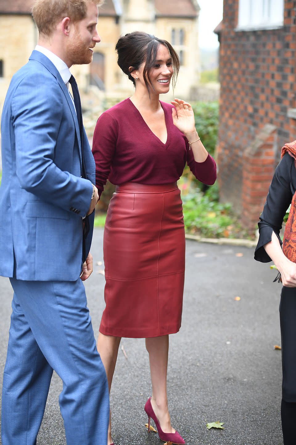 <p>Meghan Markle and Prince Harry arrived at Windsor Castle to attend a roundtable discussion on gender equality with The Queens Commonwealth Trust and One Young World in October, 2019. For the occasion, Meghan opted for a V-neck ruby red sweater, with a matching leather BOSS midi pencil skirt and suede finish court pumps. The Duchess kept her jewellery to a minimum, donning only a pair of small earrings, her rings and an understated gold bracelet.</p>