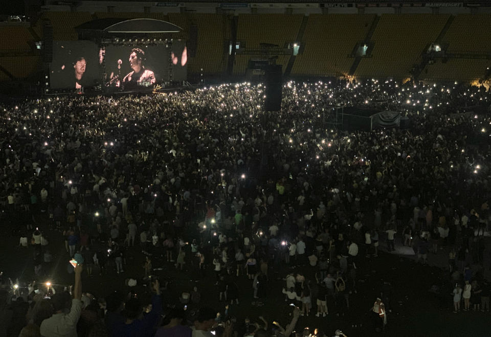 Thousands of people attend a concert by the band Six60 on Saturday, Feb. 13, 2021, in Wellington, New Zealand. New Zealand’s largest city of Auckland is being placed into a three-day lockdown Sunday following the discovery of three unexplained virus cases. (AP Photo/Nick Perry)