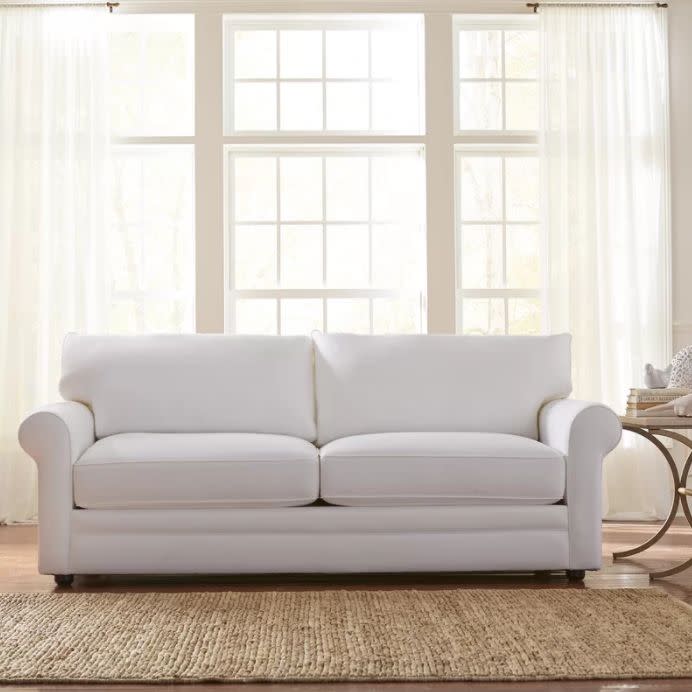 With a small space, it's key to look for pieces like the <a href="https://www.wayfair.com/furniture/pdp/birch-lane-newton-sofa-bl3428.html" target="_blank">Newton sofa</a> that are clean and minimal in design so they don't overwhelm.