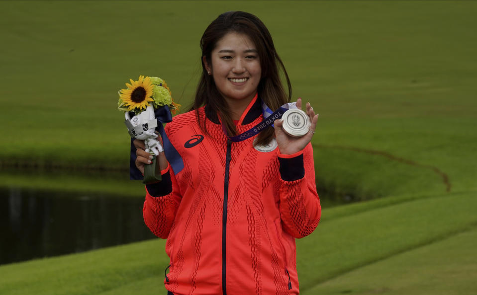 Mone Inami, of Japan, poses with her silver medal, won in the women's golf event at the 2020 Summer Olympics, Saturday, Aug. 7, 2021, at the Kasumigaseki Country Club in Kawagoe, Japan. (AP Photo/Matt York)