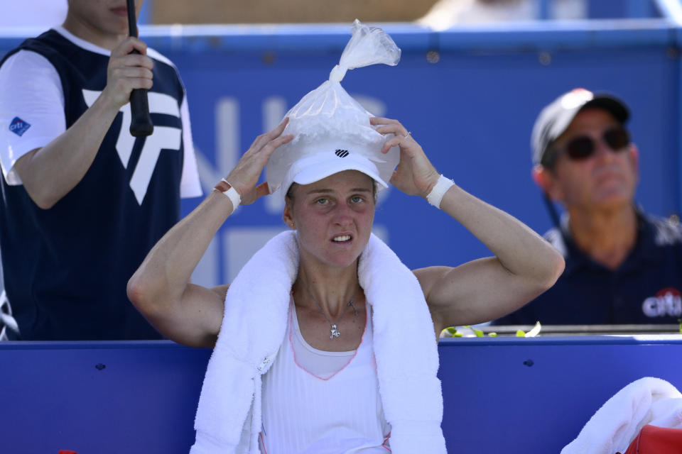 Liudmila Samsonova, of Russia, places a bag of ice on her head during a final against Kaia Kanepi, of Estonia, at the Citi Open tennis tournament Sunday, Aug. 7, 2022, in Washington. (AP Photo/Nick Wass)