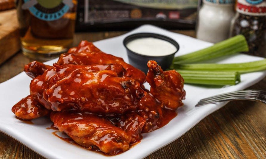 Island Wing Co. Grill & Bar specializes in baked, never fried, chicken wings. Its second Jacksonville restaurant opened Monday at 360 Bartram Market Drive in Saint Johns.