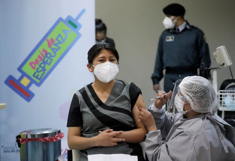 FILE PHOTO: A Bolivian healthcare worker receives a dose of Russia's Sputnik V (Gam-COVID-Vac) vaccine, in El Alto