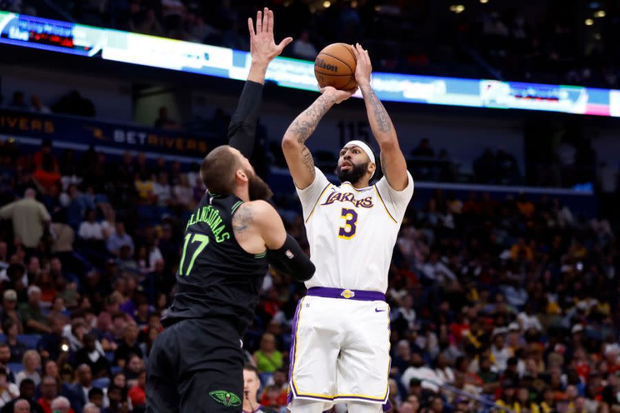 NEW ORLEANS, LOUISIANA – APRIL 14: Anthony Davis #3 of the Los Angeles Lakers shoots against <a class="link " href="https://sports.yahoo.com/nba/players/4886/" data-i13n="sec:content-canvas;subsec:anchor_text;elm:context_link" data-ylk="slk:Jonas Valanciunas;sec:content-canvas;subsec:anchor_text;elm:context_link;itc:0">Jonas Valanciunas</a> #17 of the New Orleans Pelicans at Smoothie King Center on April 14, 2024 in New Orleans, Louisiana. NOTE TO USER: User expressly acknowledges and agrees that, by downloading and or using this photograph, User is consenting to the terms and conditions of the Getty Images License Agreement. (Photo by Tyler Kaufman/Getty Images)