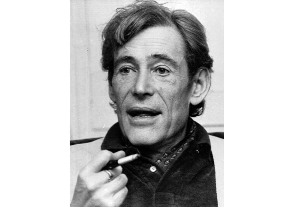 FILE - British actor Peter O'Toole smokes during an interview at his London home on Dec. 23, 1980. O'Toole appears in the 1982 film "My Favorite Year," which is celebrating its 40th anniversary. (AP Photo/Dave Caulkin, File)