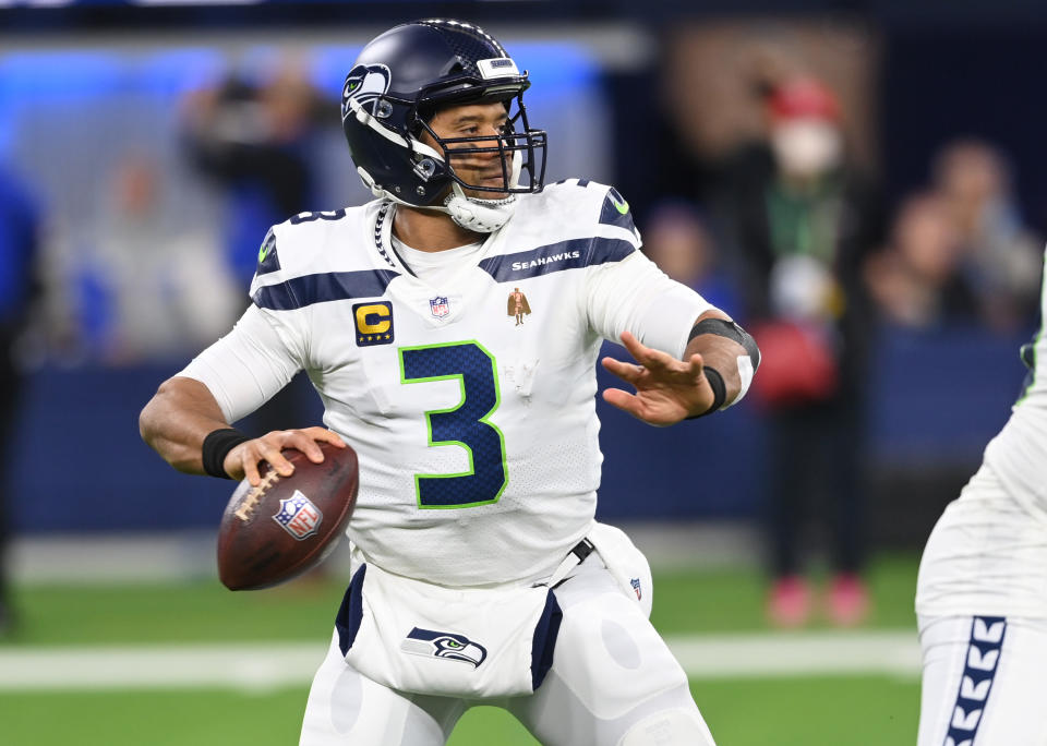INGLEWOOD, CA - DECEMBER 21: Russell Wilson #3 of the Seattle Seahawks sets to pass the ball during the game against the Los Angeles Rams at SoFi Stadium on December 19, 2021 in Inglewood, California. (Photo by Jayne Kamin-Oncea/Getty Images)