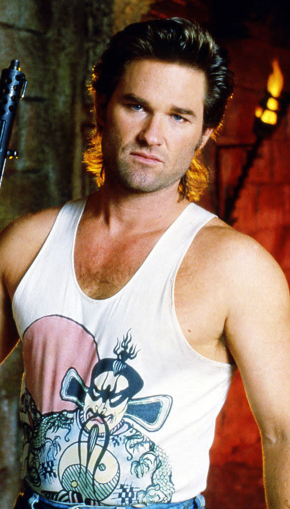 Russell in "Big Trouble in Little China" in a muscle shirt and mullet