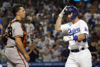 Los Angeles Dodgers' Will Smith, right, celebrates at home plate next to San Francisco Giants catcher Buster Posey after Smith's two-run home run during the fourth inning of a baseball game Thursday, July 22, 2021, in Los Angeles. (AP Photo/Marcio Jose Sanchez)