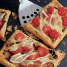 <p>Take a short cut with ready-made pastry for these speedy Mediterranean-style tarts</p><p><strong>Recipe: <a href="https://www.goodhousekeeping.com/uk/food/recipes/a536666/quick-camembert-and-tomato-tarts/" rel="nofollow noopener" target="_blank" data-ylk="slk:Quick Camembert and Tomato Tarts" class="link ">Quick Camembert and Tomato Tarts</a></strong></p>