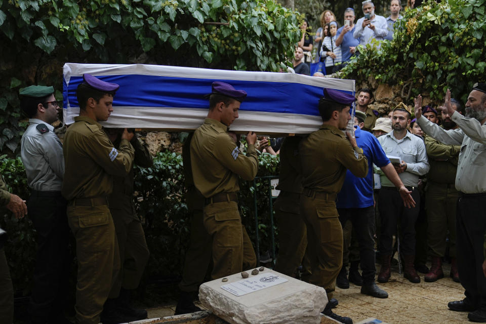 Israeli soldiers carry the flag-draped casket of Staff Sgt. Lavi Lipshitz during his funeral in the Mount Herzl Military Cemetery in Jerusalem, Wednesday, Nov. 1, 2023. Lipshitz was killed during a ground operation in the Gaza Strip. Israeli ground forces have been operating in Gaza in recent days as Israel presses ahead with its war against Hamas militants. (AP Photo/Ohad Zwigenberg)