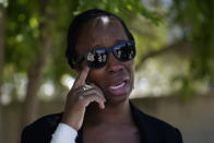 John McAfee's wife Janice gestures on leaving the Brians 2 penitentiary center in Sant Esteve Sesrovires, near Barcelona, northeast Spain, Friday, June 25, 2021. A judge in northeastern Spain has ordered an autopsy for John McAfee, creator of the McAfee antivirus software, a gun-loving antivirus pioneer, cryptocurrency promoter and occasional politician who died in a cell pending extradition to the United States for allegedly evading millions in unpaid taxes. McAfee's Spanish lawyer, Javier Villalba, said the entrepreneur's death had come as a surprise to his wife and other relatives, since McAfee "had not said goodbye." (AP Photo/Joan Mateu)