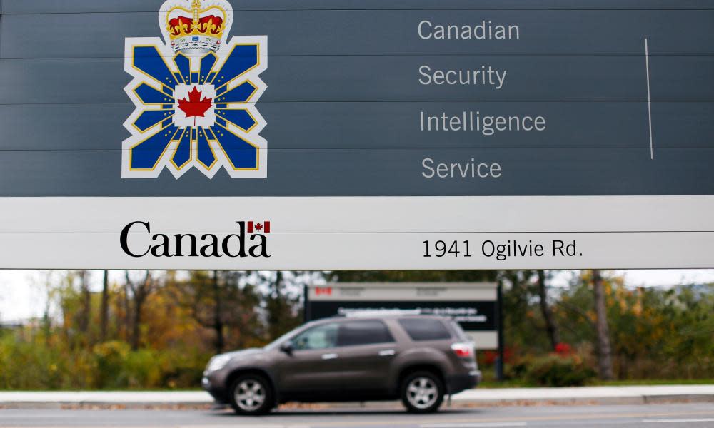 A vehicle passes a sign outside the Canadian Security Intelligence Service headquarters in Ottawa on 5 November 2014. 