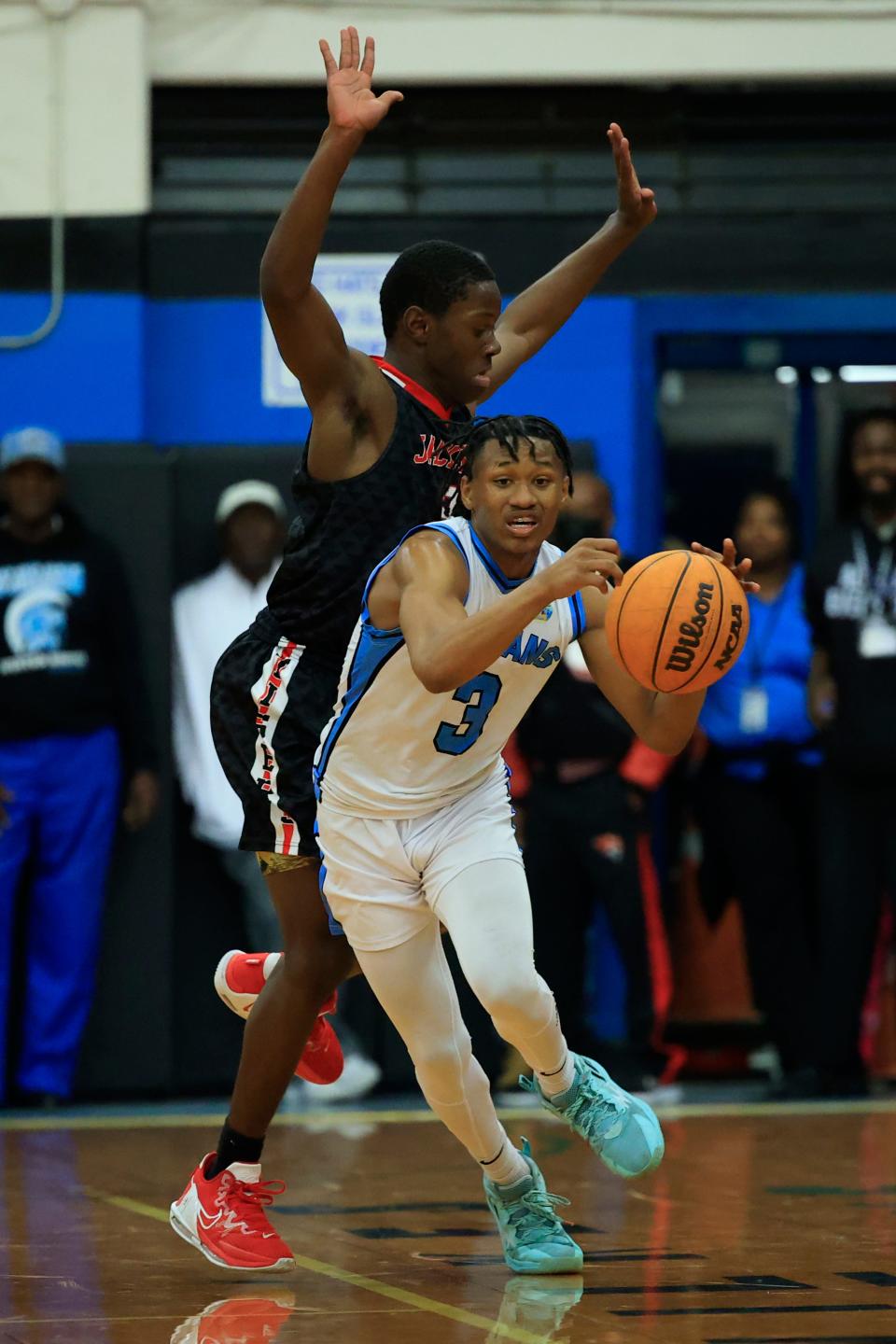 Ribault's Caleb Williams (3) dribbles against the Jackson defense during a January game. Both teams compete in the Northwest Christmas Tournament, which also includes Raines and First Coast.