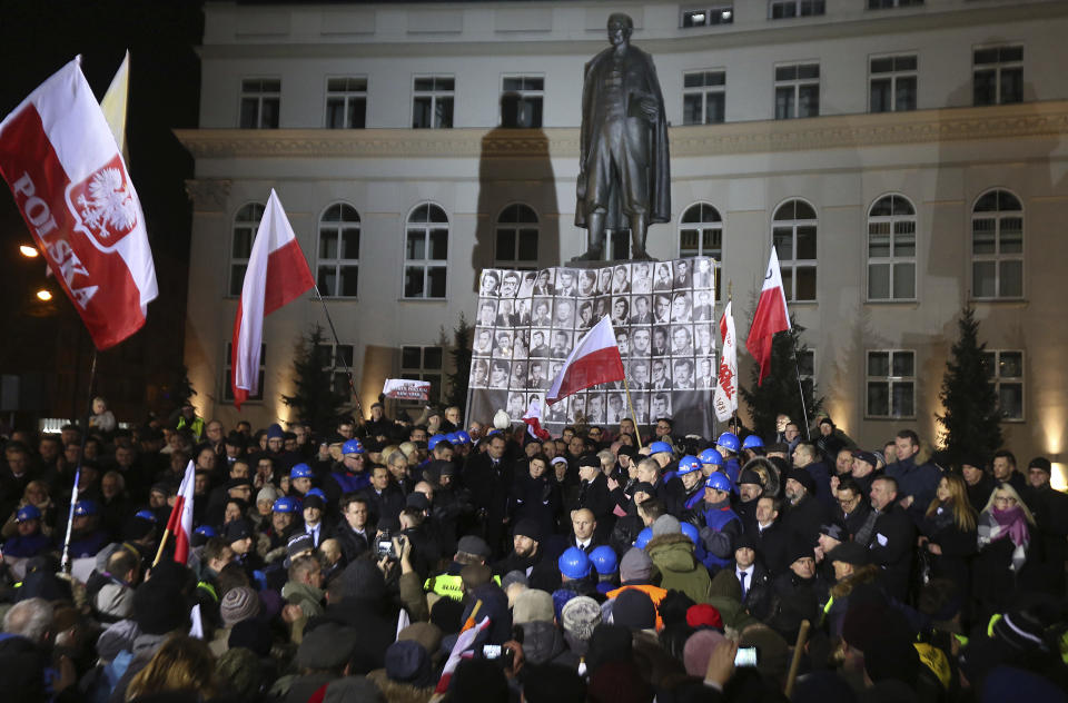 Law and Justice (PiS) party leader Jaroslaw Kaczynski, right, speaks during the demonstration organized by Polish party Law and Justice on the 35th anniversary of the introduction of martial law at Three Crosses Square, in Warsaw, Poland, Tuesday, Dec. 13, 2016. (AP Photo/Czarek Sokolowski)