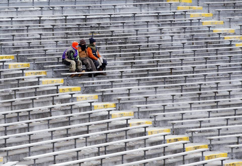 Fans sit in their seats at Lambeau Field before an NFL wild-card playoff football game between the Green Bay Packers and the San Francisco 49ers, Sunday, Jan. 5, 2014, in Green Bay, Wis. (AP Photo/Mike Roemer)