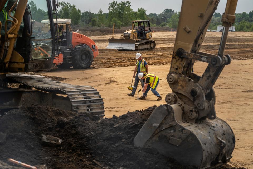 Crews work on the land where Building No. 1 at Ashley Capital's Flint Commerce Center will be developed on the former General Motors Buick City campus in Flint on Monday, June 5, 2023.