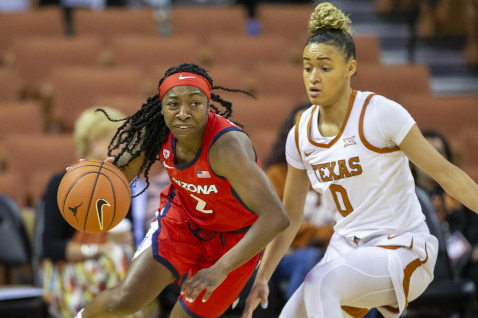 FILE - In this Sunday, Nov. 17, 2019, file photo, Arizona guard Aari McDonald (2) drives around guard Celeste Taylor (0) during an NCAA college basketball game in Austin, Texas. McDonald has chosen to return to school for her senior year instead of entering the WNBA draft, scheduled for April 17, 2020. (AP Photo/Stephen Spillman, File)