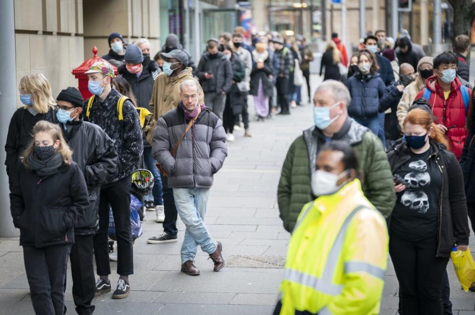 People queue outside the Edinburgh International Conference Centre (EICC) for the NHS Scotland vaccination centre (Jane Barlow/PA) (PA Wire)