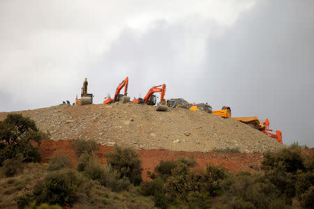 Idle diggers and trucks are seen after removing sand at the area where Julen, a Spanish two-year-old boy fell into a deep well six days ago when the family was taking a stroll through a private estate, in Totalan, southern Spain, January 19, 2019. REUTERS/Jon Nazca