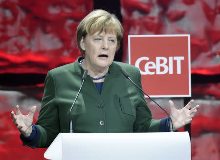German Chancellor Angela Merkel speaks during the opening ceremony of the CeBit computer fair, which will open its doors to the public on March 20, at the fairground in Hanover, Germany, March 19, 2017. REUTERS/Fabian Bimmer