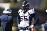 Denver Broncos outside linebacker Bradley Chubb, right, confers with head trainer Vince Garcia as Chubb takes part in drills during an NFL football practice Thursday, Sept. 16, 2021, at the team's headquarters in Englewood, Colo. (AP Photo/David Zalubowski)