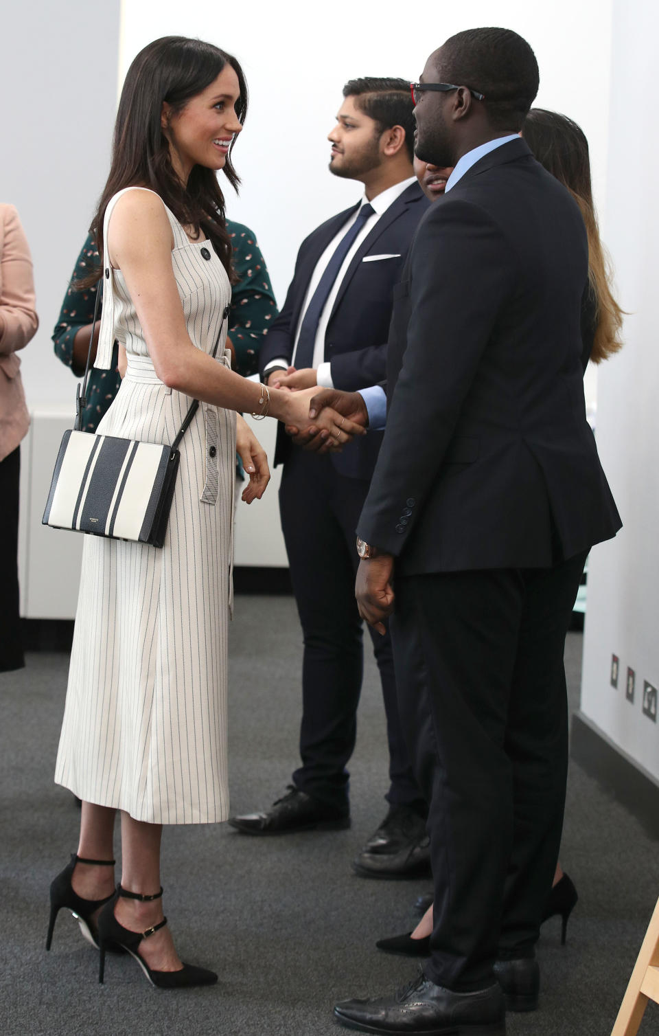 <p>Not all of Meghan’s subsersive fashion moments are met with admiration.<br>Arriving at the Commonwealth Youth Forum in April 2018 wearing an strappy Altuzarra pinstripe midi dress, the now-Duchess got a quick lesson in the furore of hard-core royalists.<br>The seemingly inoffensive strappy dress – which bared her bare shoulders – was <a rel="nofollow" href="https://uk.style.yahoo.com/meghan-markle-faces-huge-backlash-wearing-strapless-dress-dressing-like-celeb-084650788.html?guccounter=1" data-ylk="slk:met with abuse online;elm:context_link;itc:0;sec:content-canvas;outcm:mb_qualified_link;_E:mb_qualified_link;ct:story;" class="link  yahoo-link">met with abuse online</a>. <br></p><p>Still, she looked incredible. <br>[Photo: Getty] </p>