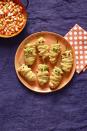 <p>Wrap jalapeno poppers with puff pastry, then add roasted red pepper or peas for mummy eyes.</p><p><strong><a rel="nofollow noopener" href="https://www.womansday.com/food-recipes/food-drinks/recipes/a56191/hot-pepper-mummies-recipe/" target="_blank" data-ylk="slk:Get the recipe;elm:context_link;itc:0;sec:content-canvas" class="link ">Get the recipe</a>.</strong></p>