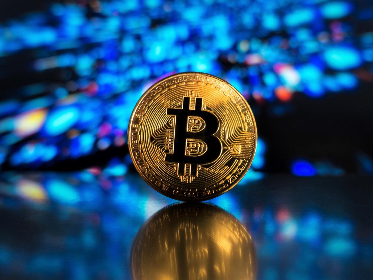 Bitcoin, cardano, dogecoin and ethereum have all hit record price highs in 2021 (Getty Images)