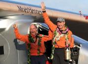 Bertrand Piccard (L) celebrates with Andre Borschberg after the Solar Impulse 2 airplane, piloted by Borschberg, landed at Kalaeloa airport after flying non-stop from Nagoya, Japan, in Kapolei, Hawaii, July 3, 2015. REUTERS/Hugh Gentry