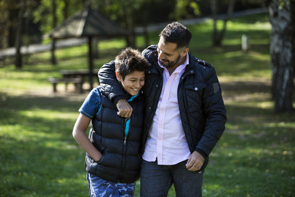 Father and son bonding on a walk outside