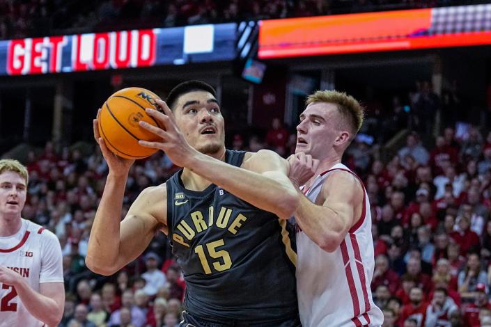 Purdue's Zach Edey (15) looks to shoot against Wisconsin's Tyler Wahl (5) in the first half of an NCAA collegiate basketball game Thursday, March 2, 2023 in Madison, Wis. (AP Photo/Andy Manis)