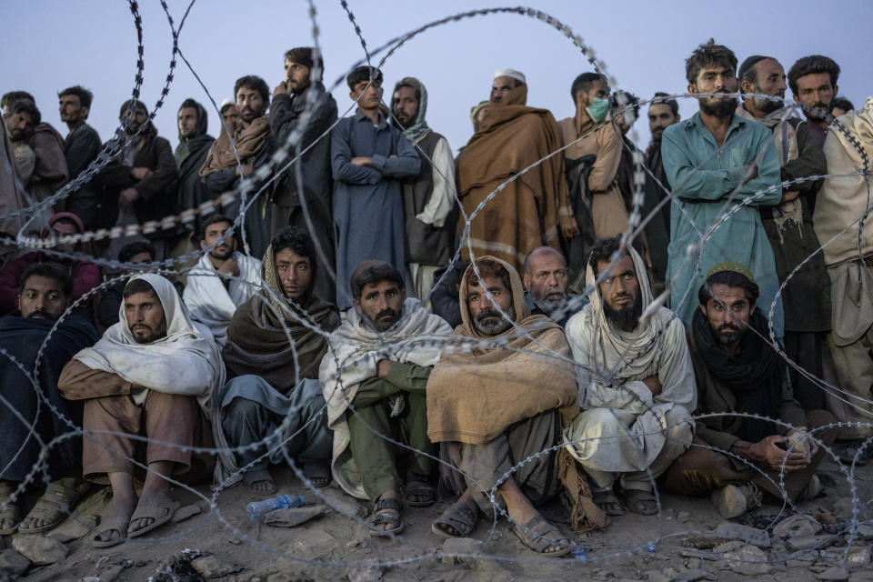 Afghan refugees wait to register in a camp near the Torkham Pakistan-Afghanistan border in Torkham, Afghanistan, Saturday, Nov. 4, 2023. A huge number of Afghans refugees entered the Torkham border to return home hours before the expiration of a Pakistani government deadline for those who are in the country illegally to leave or face deportation. (AP Photo/Ebrahim Noroozi)