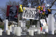 A makeshift memorial is seen Thursday, April 22, 2021, in Brooklyn Center, Minn., near the site of the fatal shooting of Daunte Wright by a police officer during a traffic stop. (AP Photo/Morry Gash)